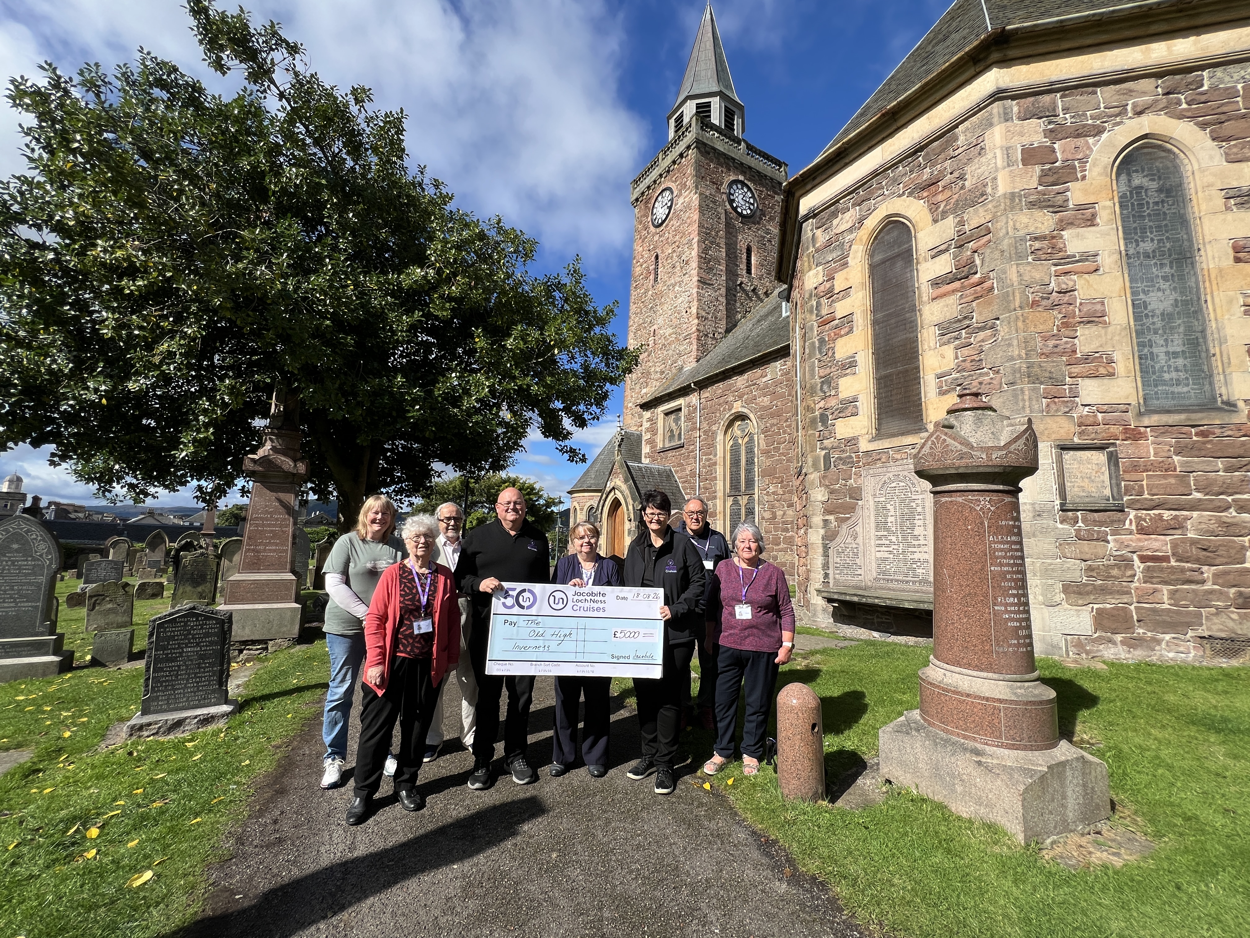 Jacobite hand over cheque to The Old High, Inverness