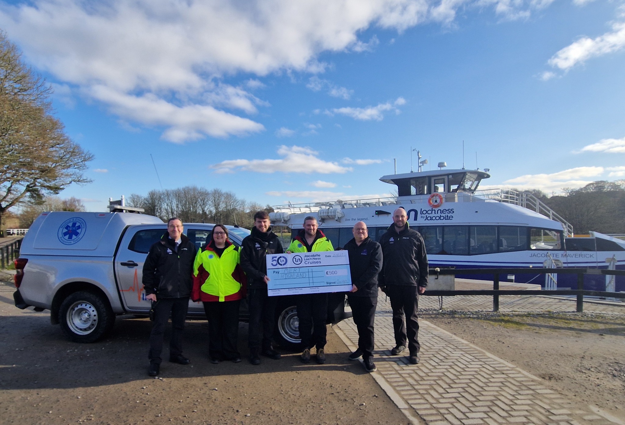 Handing over a donation of £500 to MERT Highland