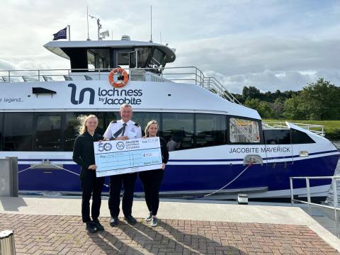 Handing over a cheque to Lucky2BeHere Charity as part of our 50 year anniversary